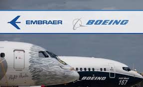 2 aviões e as marcas Embraer e Boeing na fachada